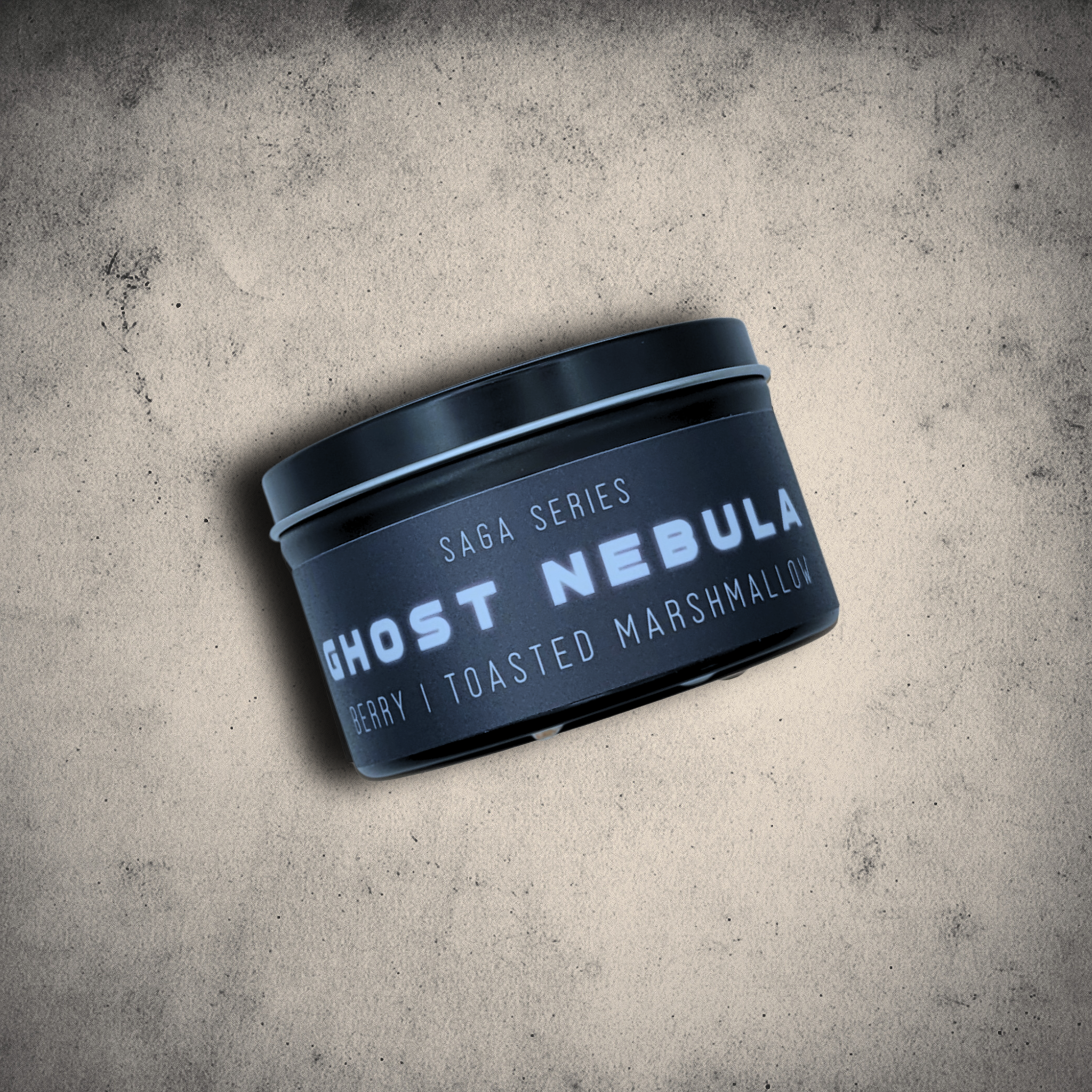 Emberlight Archives Ghost Nebula candle in an 8oz black tin with illustrated nebula label against a gray stone background, Berry & Marshmallow scent.